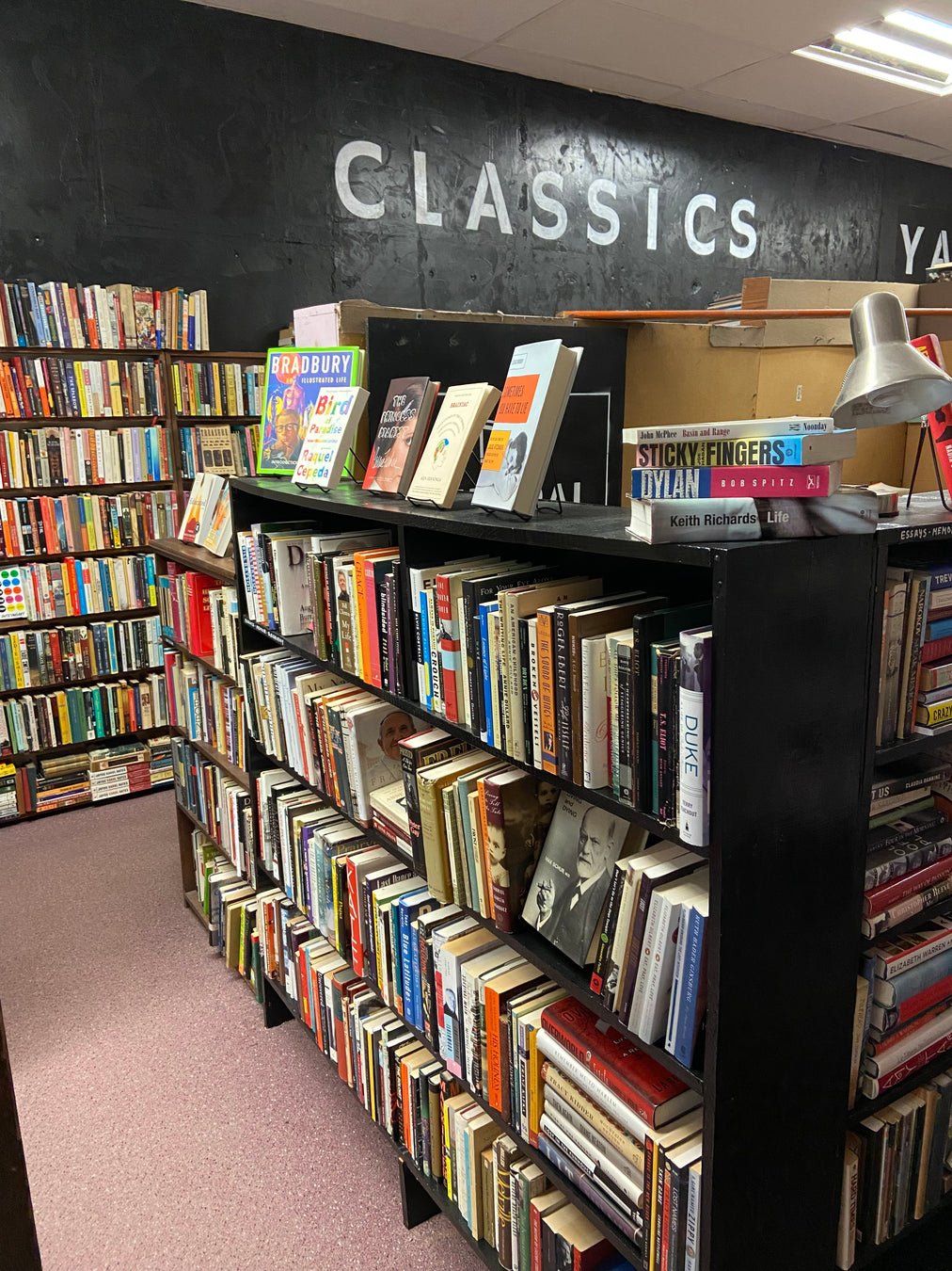 memoir section with classics sign